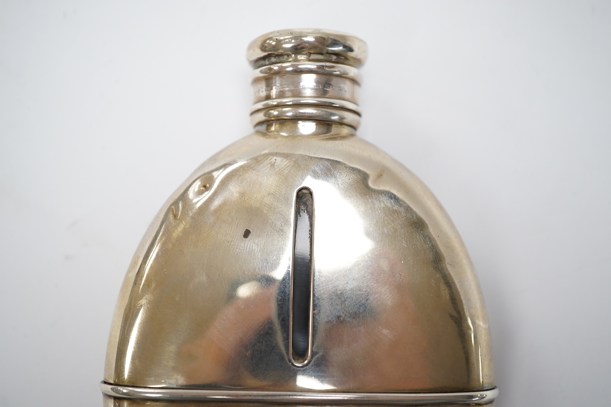 A Victorian silver oval pocket flask, John Linegar, Birmingham, 1872, 12.8cm. Condition - poor